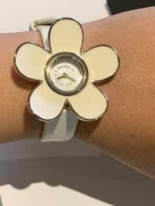Marc jacobs white flower watch.