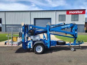 Genie TZ/34 trailer mounted cherry picker elevating work platform