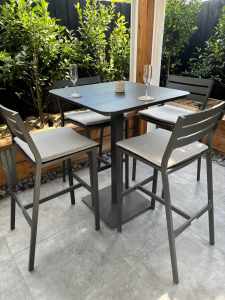Outdoor bar table and four bar stools