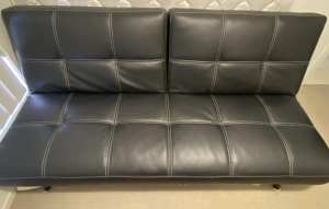 Black leather look click clack couch/futon.

