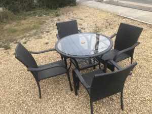 Five piece Cane table and chairs in near new condition