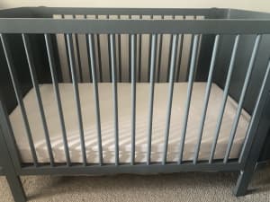 Cot, mattress, change table and bedding