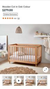 Wooden oak cot with rounded corners 
