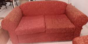 Two Seater sofa red colour with red leaf pattern