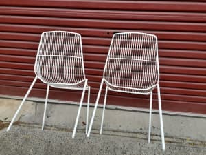 2 white metal outdoor .chairs 