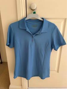 Womens Light blue Greg Norman golf shirt- used. Size M/M (US 10-12)