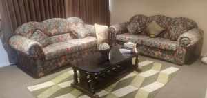4 piece sofa bed set with coffee table, vase and rug!