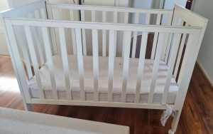 White colored baby cot