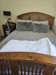 Double timber bed with two bedside cabinets 