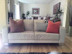 Nick Scali 2.5 seater leather sofa and two matching armchairs.