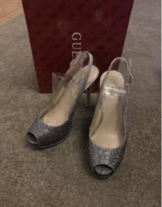 Brand new guess ladies shoes. Size 7. Black and silver glitter