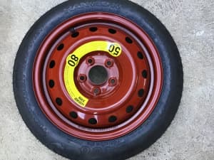 16 Space Saver spare wheel with 5x114.3 stud pattern.