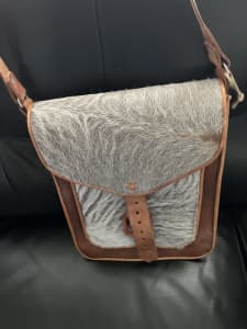 As new condition, fur across bag.