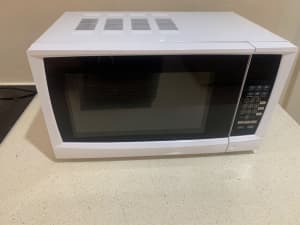 Small white microwave in perfect condition