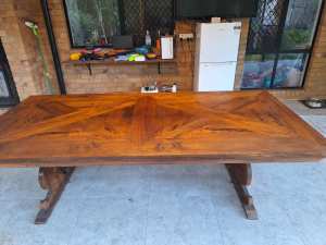 Solid timber dining table seats 10 to 12