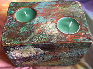 Wood tea lights holder with two green candles