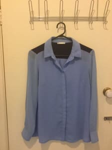 Target size 10 shirt imperfect. Nic’s $2 specials § or 3 for $5