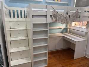 White Loft Bed with custom made cupboards, shelving and desk.