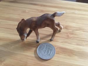 Ceramic Foal grazing miniature figurine