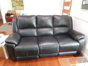 Two 3 seater leather lounge suite each set with two electric recliners