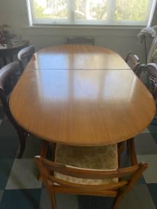 Dinning room table and antique chairs