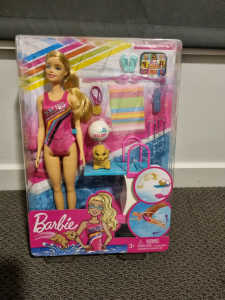 Barbie swim and drive doll brand new