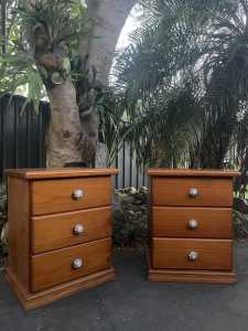 Two solid timber 3 drawer bedside tables 