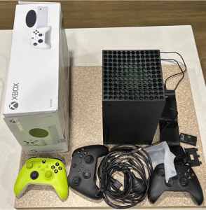 Xbox X and Xbox S consoles with extra controllers