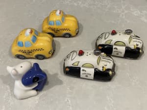 Salt and pepper shakers. Yellow cabs, police cars and dogs