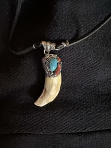 Authentic Navajo bear tooth pendant set in 925 silver