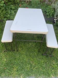 Camping table with attachable stools