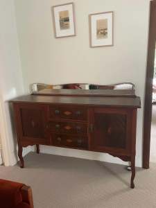 Wooden sideboard with three central drawers and two cupboards