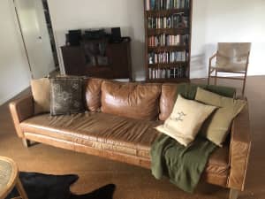 Tan Brown 3 seater leather couch with timber feet