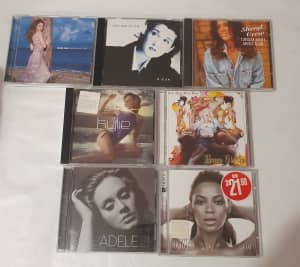 Assorted cds popular artists Adele Beyonce Santana etc