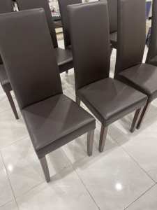 8 High back chocolate brown chairs in great condition $300 for the lot