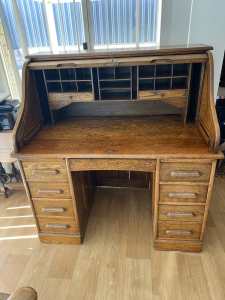 Circa 1900 English oak roll top desk.