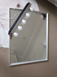Mirror with wall lamp