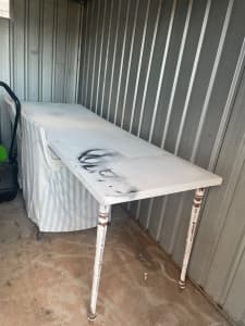 Long makeshift table with screw legs, wonky, not sturdy