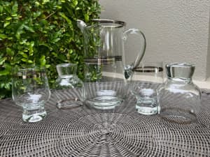 Glassware. Jug and 4 block stemmed glasses with silver rims.