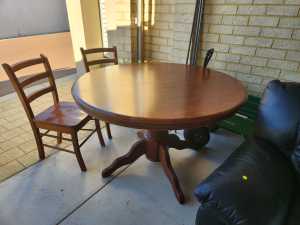Round extendable dining table with 2 chairs