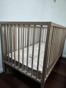 Wooden cot bed with mattress