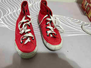 girl Nike red shoes still in good condition size 5