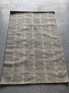 Medium sized rug, never used. Pristine condition