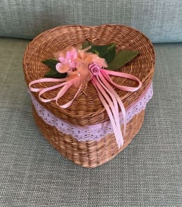 2 HEART SHAPED CANE BOXES WITH FLOWERS ON TOP -