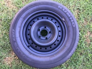 Single 16 Ford Falcon steel wheel with 215 60 16 tyres with around 50