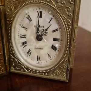 Pending Vintage German Book shaped travel clock. 2 Jewels. Gold plated