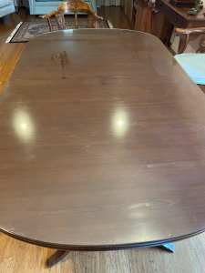 Dining table in solid timber with protective glass top