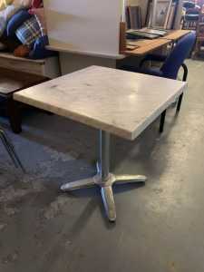 Nice Square restaurant table with a grey and white marble top