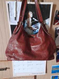 Beautiful brown American leather floral pattern handbag in good condit