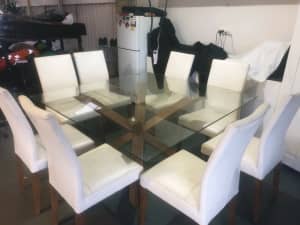 Glass table 1500 X 1500 with 8 Leather seats